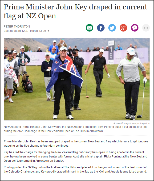 Prime Minister John Key draped in current flag at NZ Open
